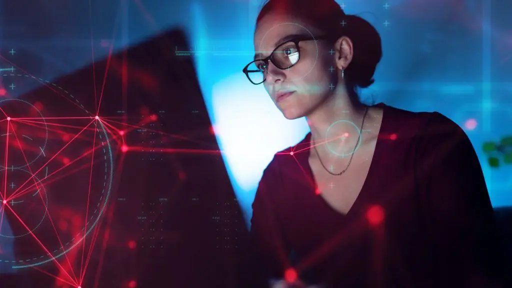 A software developer analyzing futuristic data visualizations.