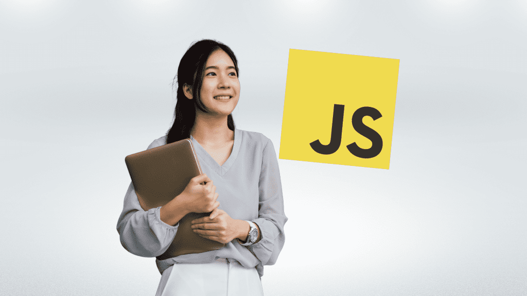 A developer smiling while holding a laptop with a JavaScript